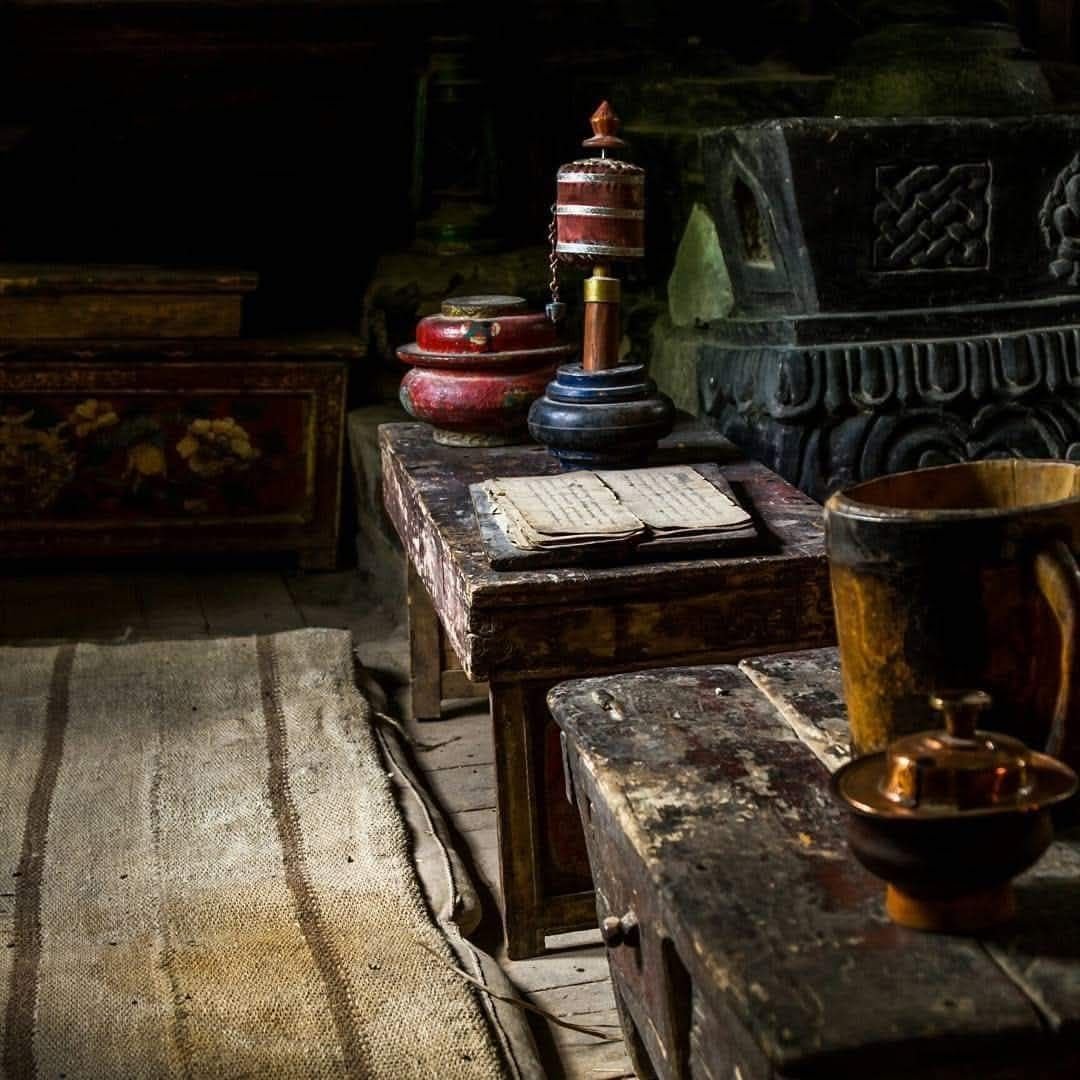 Prayer wheel and old scriptures